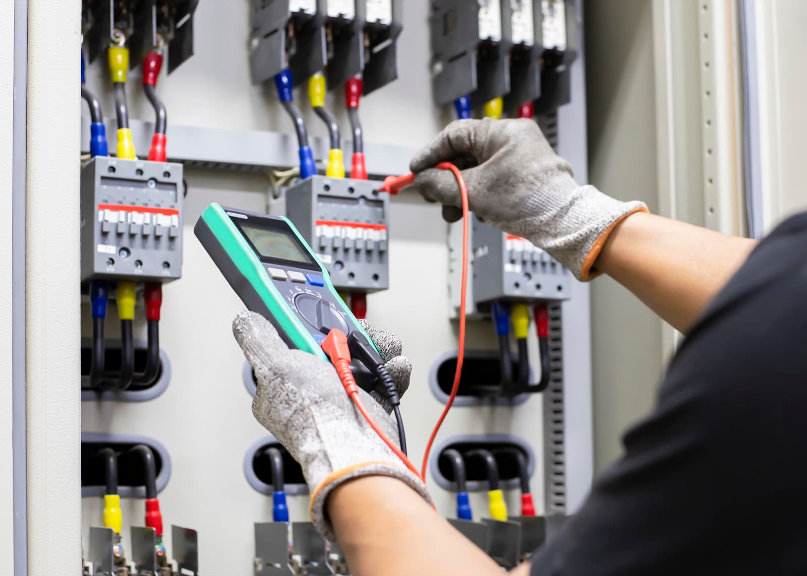 OP Electrical electrician working on a panel in Los Angeles